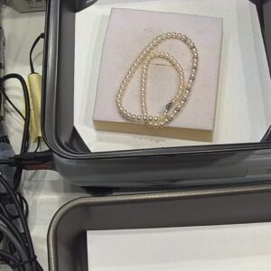 Filo di perle inserti oro comete